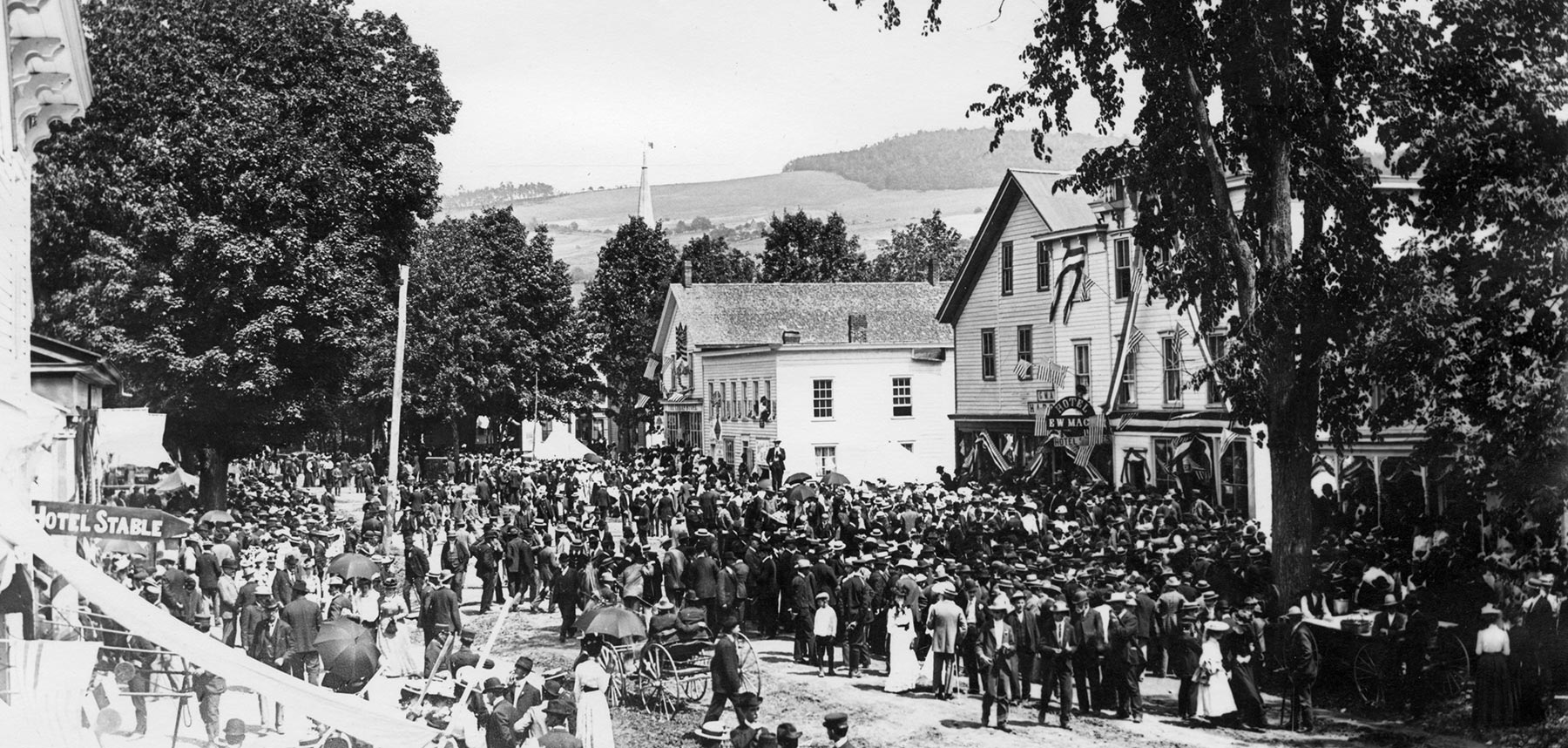 Historical photo of crowd of people on Main Street